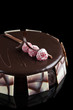 Sacher cake decorated with raspberries