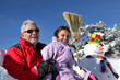 Father and daughter making a snowman