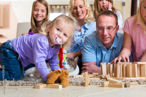 Photo: Family playing at home Family playing at home