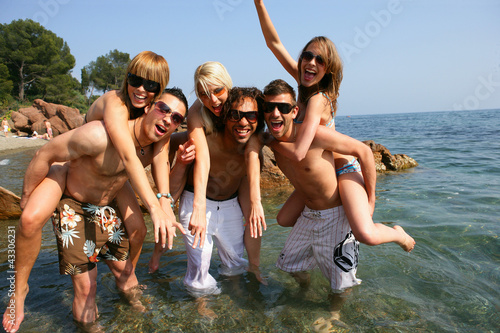 Photo: young people having fun at beach young people having fun at beach