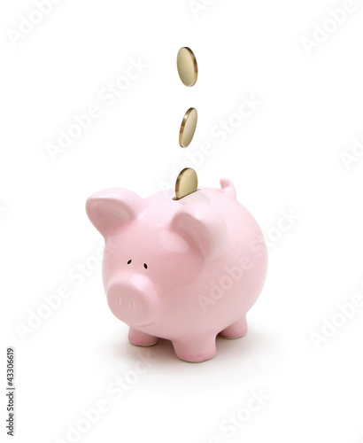 Illustration: Golden coins falling into a piggy bank isolated on white Golden coins falling into a piggy bank isolated on white