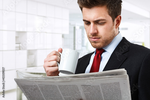 Photo: Businessman reading the newspaper Businessman reading the newspaper