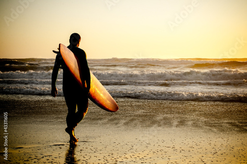 Photo: Surfer walking Surfer walking