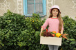 Photo: Girl with a box of vegetables Girl with a box of vegetables
