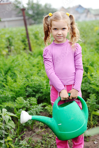 Photo: Girl with a water can Girl with a water can