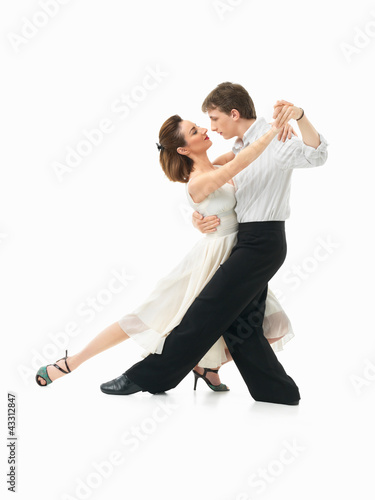 Photo: passionate dancing couple on white background passionate dancing couple on white background