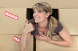Positive woman with packing boxes