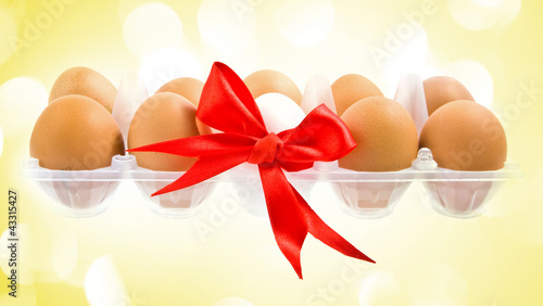 Photo: White egg wrapped around with red ribbon and pack White egg wrapped around with red ribbon and pack