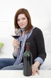 woman with a bottle wine and a wineglass