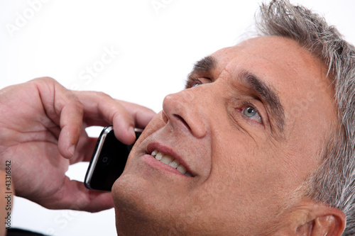 Photo: Portrait of man on the phone Portrait of man on the phone