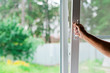 a man opens a window