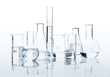 Set of classic laboratory flasks with a clear liquid, isolated