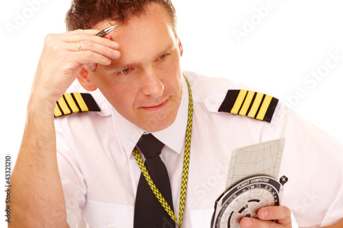 Photo: Airline pilot using flight computer Airline pilot using flight computer