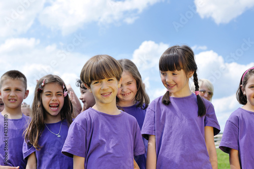 Photo: happy kids group have fun in nature happy kids group have fun in nature