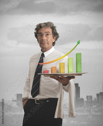 Photo: Businessman and positive statistics Businessman and positive statistics
