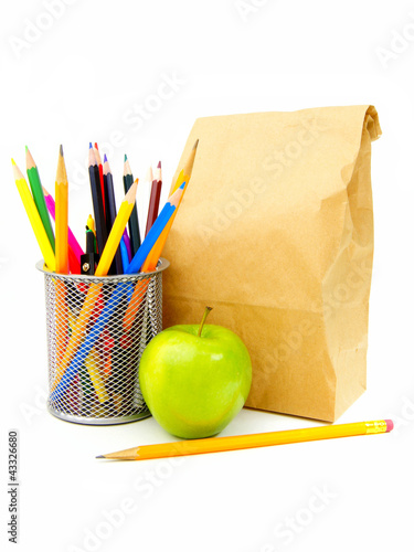 Photo: School lunch bag with apple, pencil and school supplies School lunch bag with apple, pencil and school supplies