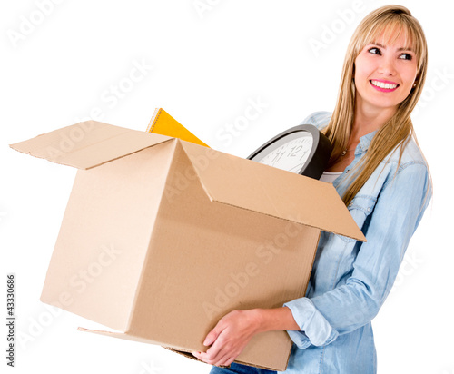Photo: Woman carrying a box Woman carrying a box