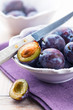 Fresh plums in a bowl