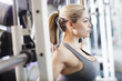 Mixed race woman exercising in health club