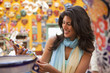 Hispanic woman shopping for souvenirs