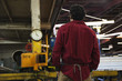 Mixed race worker standing in factory