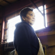 Mixed race worker standing in factory