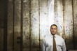 Hispanic worker standing near plastic curtain in factory