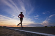 Caucasian runner training on remote road