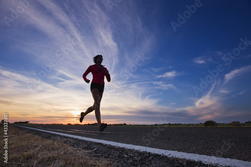 Photo: Caucasian runner training on remote road Caucasian runner training on remote road