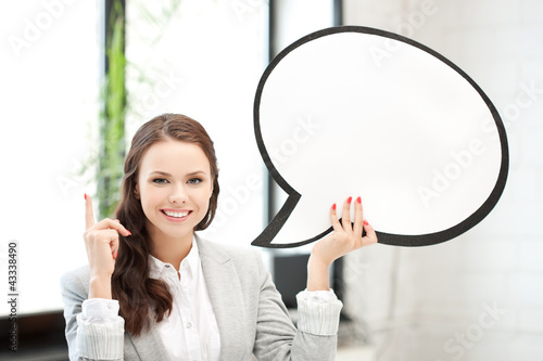 Photo: smiling businesswoman with blank text bubble smiling businesswoman with blank text bubble