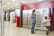 Hispanic mother and son looking at refrigerators