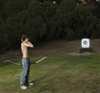 Mixed race archer with bow looking at target