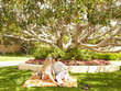 Caucasian couple kissing and having picnic