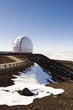 Observatory on snowy hilltop