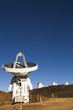Observatory and satellite dish on hillside