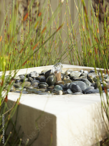 Photo: Modern pebble-filled water fountain Modern pebble-filled water fountain