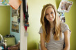 Smiling mixed race teenager in bedroom