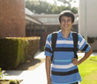 Smiling mixed race student wearing backpack
