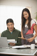 Korean couple paying bills together