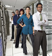 Business people standing together in server room