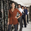 Business people standing together in server room