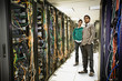 Businessmen standing together in server room