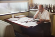Caucasian restaurant owner working in booth
