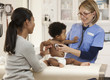 Doctor examining baby boy