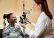 Optician adjusting equipment for patient