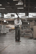 Black businessman standing in warehouse