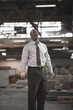 Black businessman laughing in warehouse
