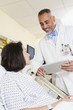 Doctor talking to patient in hospital