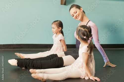Photo: Girls taking ballet lessons from teacher Girls taking ballet lessons from teacher