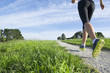 Chinese woman running along path